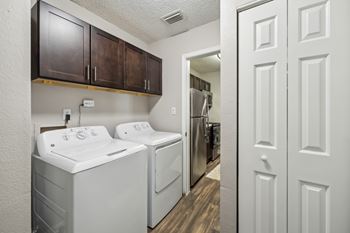 A laundry room with a washer and dryer.