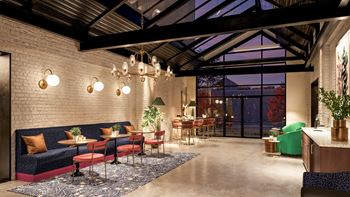 A modern interior with a brick wall and a glass ceiling