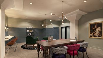 A room with a long table surrounded by chairs