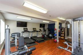 Raleigh apartment for rent - A well-equipped home gym with a variety of exercise machines at Clarion Crossing Apartments, PRG Real Estate Management, Raleigh