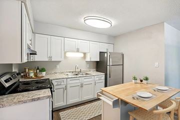 Raleigh apartment for rent - A kitchen with a table set for two.
