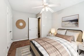 Hampton apartment for rent - A bedroom with a large bed and a painting on the wall at Rivers Landing Apartments, Virginia, 23666