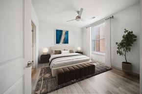 Richmond apartment for rent - A bedroom with a large bed and a ceiling fan at Circ Apartments, Virginia