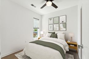 Richmond apartment for rent - a bedroom with a large bed and a ceiling fan at The Box, Richmond, 23224