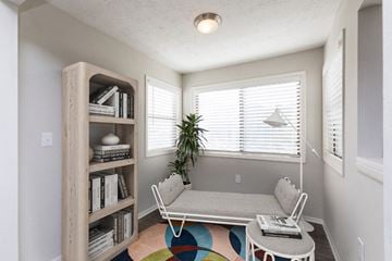 Greenville apartment for rent - a living room with a couch and a table and a window