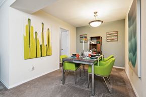 Raleigh apartment for rent - a dining room with a table and chairs and a painting on the wall  at Lake Johnson Mews, Raleigh, 27606