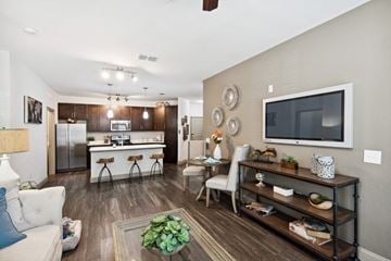 Jacksonville apartment for rent - our apartments offer a living room with a couch a coffee table and a flat screen tv