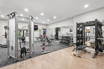 Fitness center with strength training and weightlifting equipment at park ridge estates in durham, nc