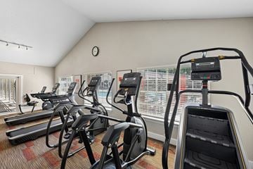 Winter Garden apartment for rent - A gym with treadmills, exercise bikes, and elliptical machines.