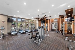 Jacksonville apartment for rent - Spacious fitness center with cardio machines and strength-training equipment at The Loree Apartments in Jacksonville, FL