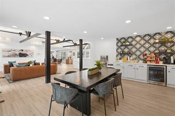 Durham apartment for rent - A modern kitchen with a dining table and chairs in the foreground.
