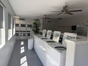 Phoenix apartment for rent - A laundromat with washers and dryers lined up.