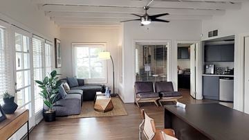 Phoenix apartment for rent - A living room with a grey couch and a brown coffee table.