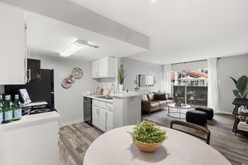 Phoenix apartment for rent - A modern kitchen with a dining table and chairs.