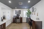 Phoenix apartment for rent - A kitchen with a white counter top and wooden floors.