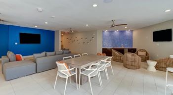 A living room with a white ceiling and a blue wall.