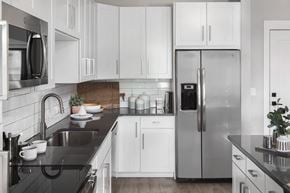 Charlotte apartment for rent - Kitchen with stainless steel appliances at Pointe at Research Park Apartments, North Carolina