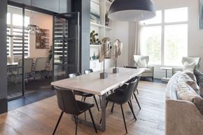 Tampa apartment for rent - A modern dining room with a large table and chairs.