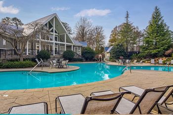 Resort-style swimming pool with aqua sun deck and hot tub