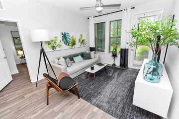 Apopka apartment for rent - a living room with a couch and a table