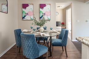 Las Vegas apartment for rent - A dining room with a table set for two and two chairs.