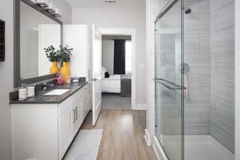 Ensuite bathroom with glass shower and white vanity