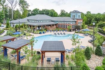Poolside covered porch with soft seating and flat screen tv