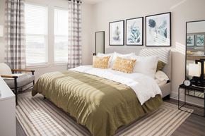 Apopka apartment for rent - Bedroom with neutral bedding and botanical artwork at POINTE AT EAST SHORE Apartments, Florida, 32703