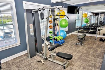 Fitness center with cable machine and training equipment
