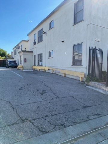 Los Angeles apartment for rent - A white building with a black gate on the right side.