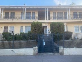 Los Angeles apartment for rent - A building with a black gate in front.