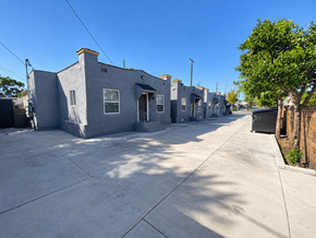 Los Angeles apartment for rent - A row of grey houses with a tree on the right side.