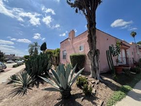 Los Angeles apartment for rent - A pink house with a tree in front of it.