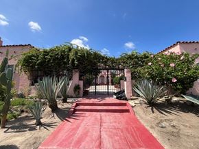Los Angeles apartment for rent - A red carpet leads to a building entrance.