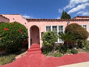 Los Angeles apartment for rent - A red building with a red door and steps leading to it.