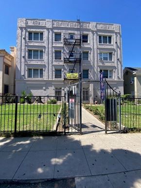 Los Angeles apartment for rent - A white building with a black gate in front.