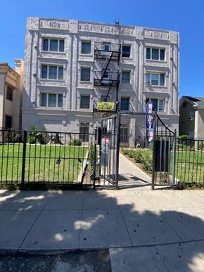 Los Angeles apartment for rent - A building with a black gate in front of it.