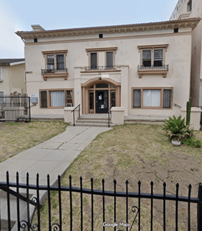 Los Angeles apartment for rent - A beige house with a black fence in front.