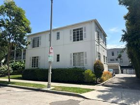 Los Angeles apartment for rent - A white building with a no parking sign in front of it.