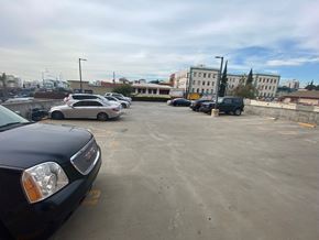 Los Angeles apartment for rent - A black car is parked in a parking lot.