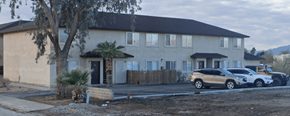 Bullhead City apartment for rent - A house with a brown roof and a tree in front.