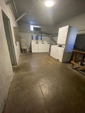 Los Angeles apartment for rent - A room with white cabinets and a table in the corner.