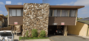 Los Angeles apartment for rent - A house with a stone wall and the number 1907 on it.