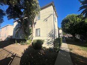 Van Nuys apartment for rent - A house with a tree in front of it.
