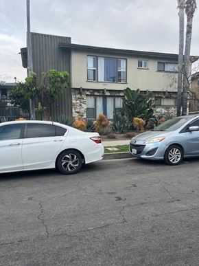 Los Angeles apartment for rent - Two cars parked in front of a house.