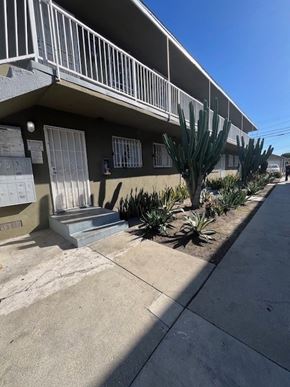 Los Angeles apartment for rent - A row of houses with a cactus in front of them.