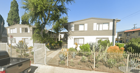 Los Angeles apartment for rent - A house with a grey roof and a fence in front of it.