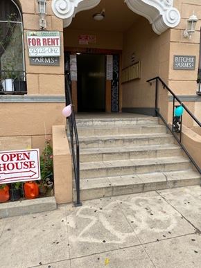 Los Angeles apartment for rent - A building with a for rent sign and an open house sign.
