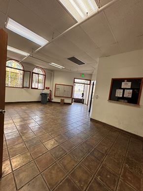 Los Angeles apartment for rent - A room with brown tile flooring and white walls.