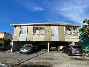 Los Angeles apartment for rent - A car is parked in front of a building.